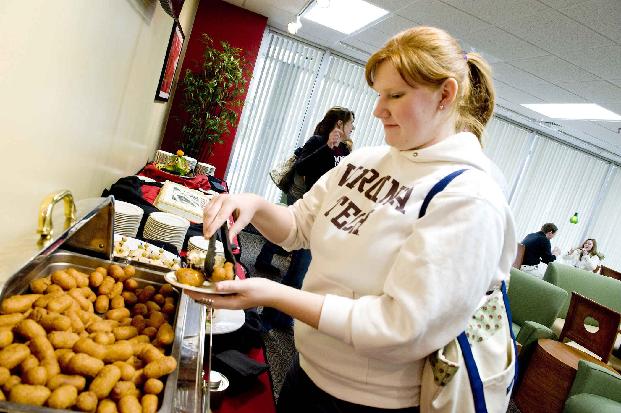 A student tries samples of food from the new DXpress menu. 