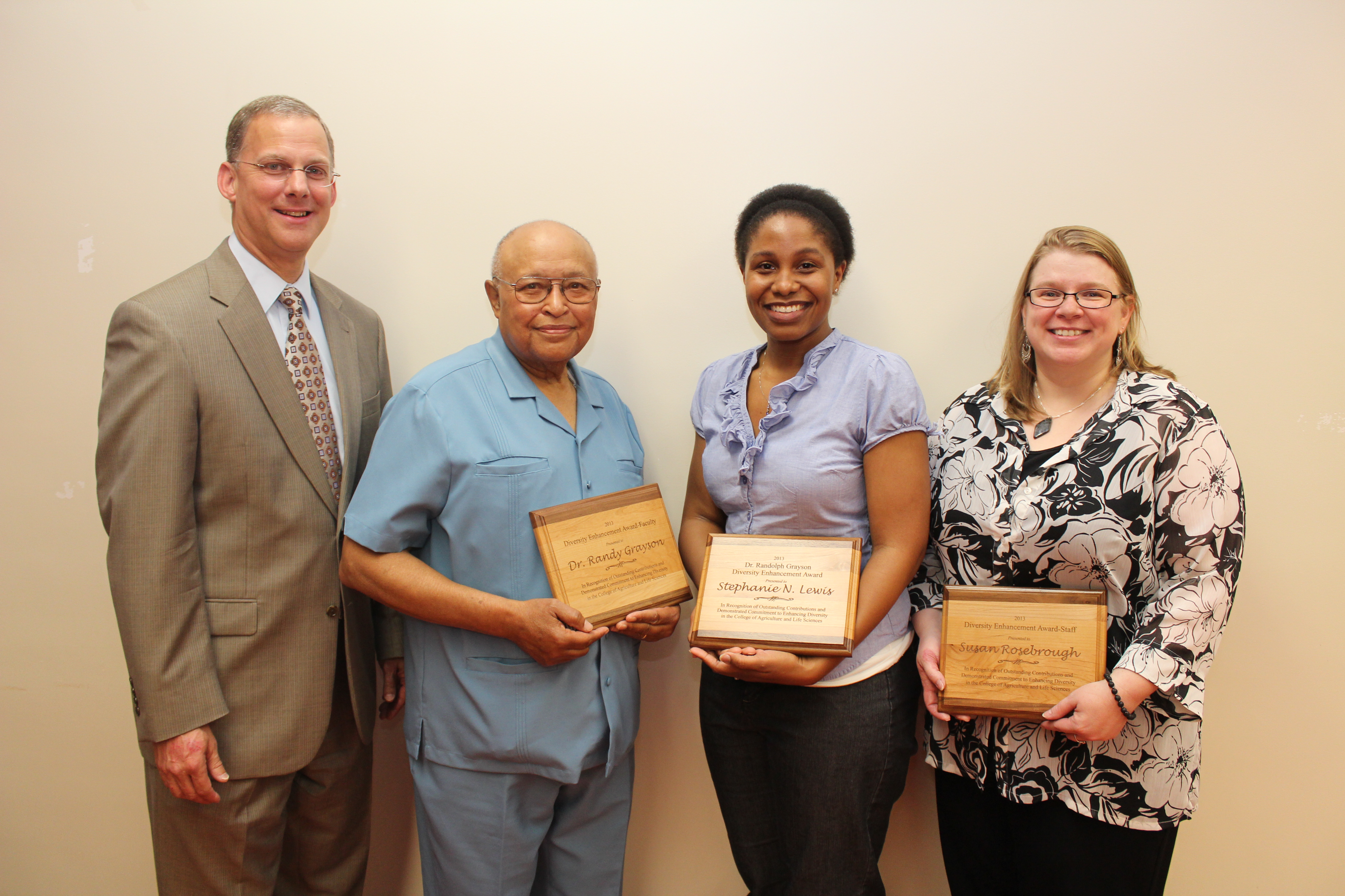 College of Agriculture and Life Sciences Dean Alan Grant stands next to three recipients of the college’s Diversity Enhancement Award: Professor Emeritus Randolph Grayson, graduate student Stephanie “Nikki” Lewis, and staff member Susan Rosebrough.