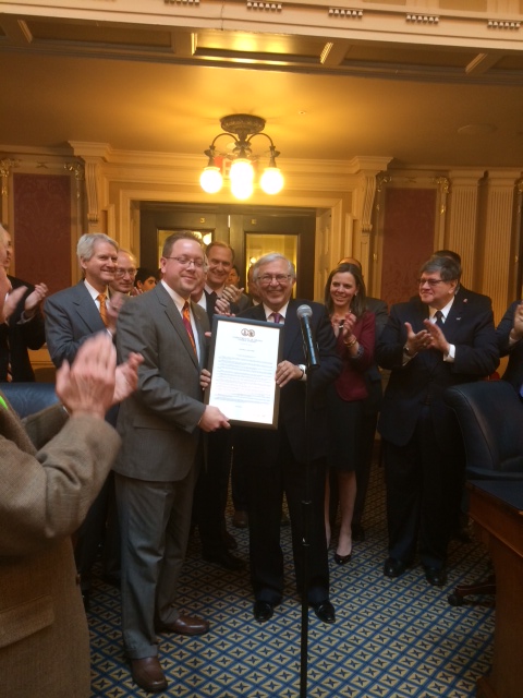 Virginia Tech President Charles W. Steger (center) receives the award