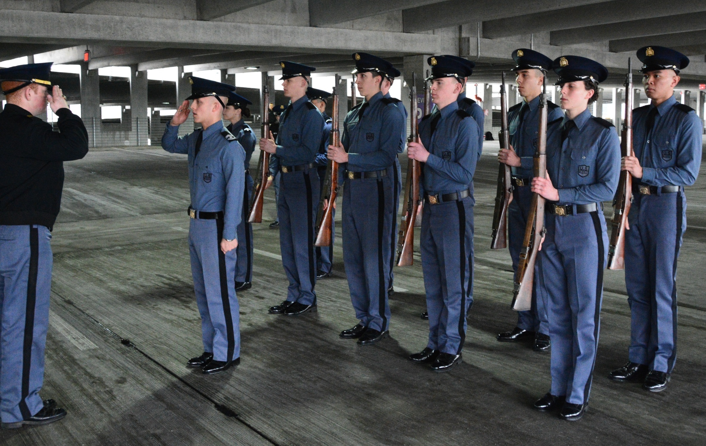 A cadet squad reports in as part of the Jaffe Eager Squad drill competition in the Turner Street parking garage.